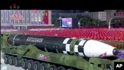 FILE - This image made from video broadcasted by North Korea's KRT, shows a military parade with what appears to be possible new intercontinental ballistic missile at the Kim Il Sung Square in Pyongyang, October 10, 2020. (KRT via AP)