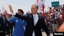 Malta's Prime Minister and Labour Party leader Joseph Muscat and his wife Michelle arrive at his office, the Auberge de Castille, after his swearing-in ceremony in Valletta, Malta, June 5, 2017. 