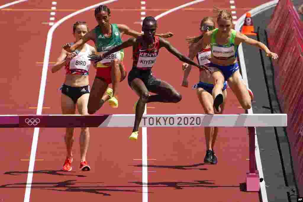 Hyvin Kiyeng, of Kenya, wins a heat of the women&#39;s 3,000-meter steeplechase at the 2020 Summer Olympics, Sunday, Aug. 1, 2021, in Tokyo. (AP Photo/Charlie Riedel)