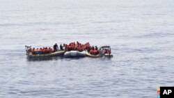 This undated image made available Monday, May 30, 2016 by the Italian Navy Marina Militare shows migrants being rescued at sea. Survivor accounts have pushed to more than 700 the number of migrants feared dead in Mediterranean Sea shipwrecks over three days in the past week, even as rescue ships saved thousands of others in daring operations. (Italian Navy via AP)