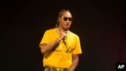 FILE - Rapper Future performs in concert in Baltimore.