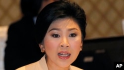 Thailand's Prime Minister Yingluck Shinawatra speaks during her meeting with election commissioners at the Army Club, Jan. 28, 2014 in Bangkok