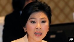 Thailand's Prime Minister Yingluck Shinawatra speaks during her meeting with election commissioners at the Army Club, Jan. 28, 2014 in Bangkok)