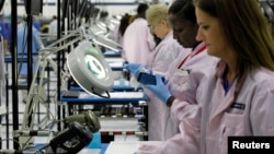 Workers assemble Motorola phones at a Flextronics plant in Fort Worth, Texas. (File)