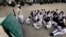 Students attend class at the Musa Neka Public School in Wana, the main town in Pakistan's South Waziristan tribal region bordering Afghanistan November 28, 2012. In a Pakistan army base high in the mountains on the Afghan frontier, a general explains a st