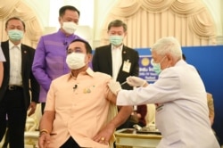 Thailand's Prime Minister Prayuth Chan-ocha receives an injection of the AstraZeneca coronavirus disease (COVID-19) vaccine at the Government House in Bangkok, Thailand, March 16, 2021.