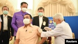 FILE - Thailand's Prime Minister Prayuth Chan-ocha receives an injection of the AstraZeneca coronavirus disease (COVID-19) vaccine at the Government House in Bangkok, Thailand, March 16, 2021. (Reuters)