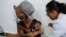 A boy cries as he receives a vaccine against yellow fever at a public health center in Sao Paulo, Brazil, Jan. 16, 2018. 