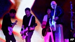 Jeff Schroeder, from left, Jack Bates, James Iha and Billy Corgan of Smashing Pumpkins perform at The Forum, Aug. 30, 2018, in Inglewood, California