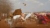 A dust storm sweeps through a makeshift camps in Baidoa, west of Somalia's capital Mogadishu, March 26, 2017. 