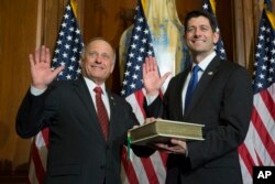 House Speaker Paul Ryan of Wis. administers the House oath of office to Rep. Steve King, R-Iowa., during a mock swearing in ceremony on Capitol Hill, Jan. 3, 2017.
