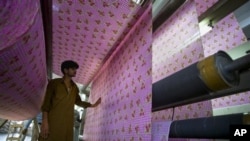 Pakistani worker at a textile factory in Faisalabad, Pakistan.