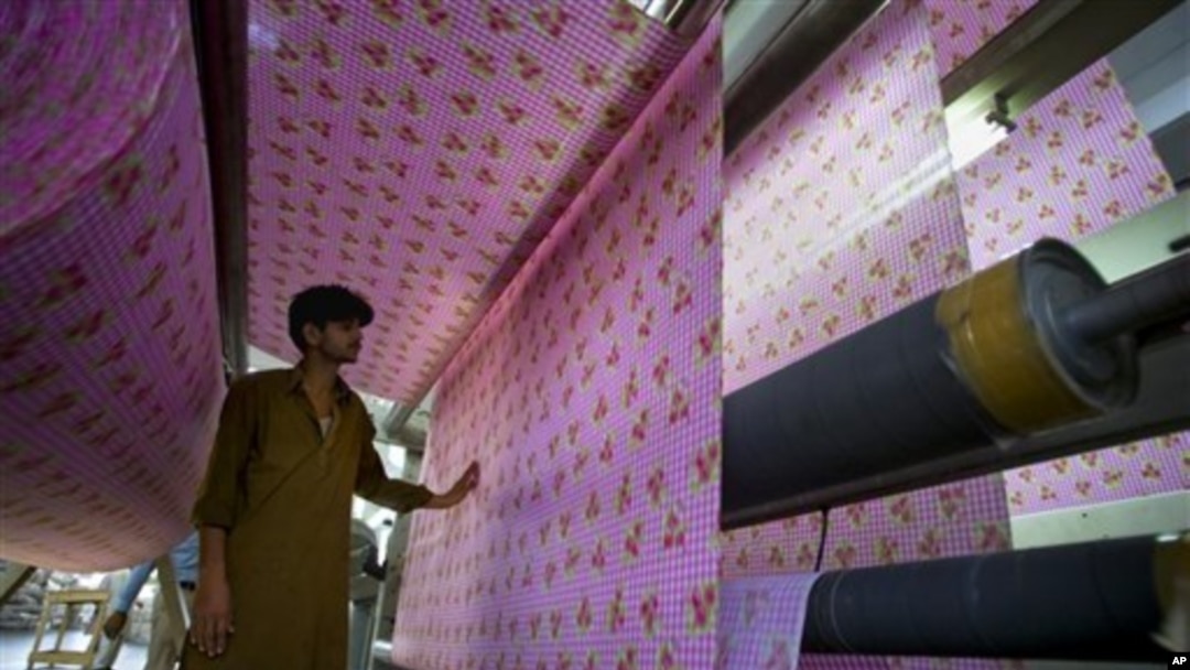 Pakistani worker at a textile factory in Faisalabad, Pakistan.