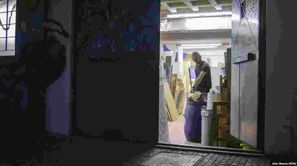 Work continues in the workshop of the Khora center at night, in the Exarchia district in Athens, Greece, Oct. 26, 2016.