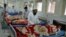 Doctors assist wounded in a hospital after they were injured in a suicide attack, in Jalalabad, capital of Nangarhar province, Afghanistan, Jan. 17, 2016. The United Nations urged on Feb. 23, 2016, the warring sides in Afghanistan to respect "the provision of healthcare, never to harm medical personnel and patients."