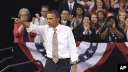 President Barack Obama points to the crowd following his speech at North Carolina State University in Raleigh, North Carolina, September 14, 2011.