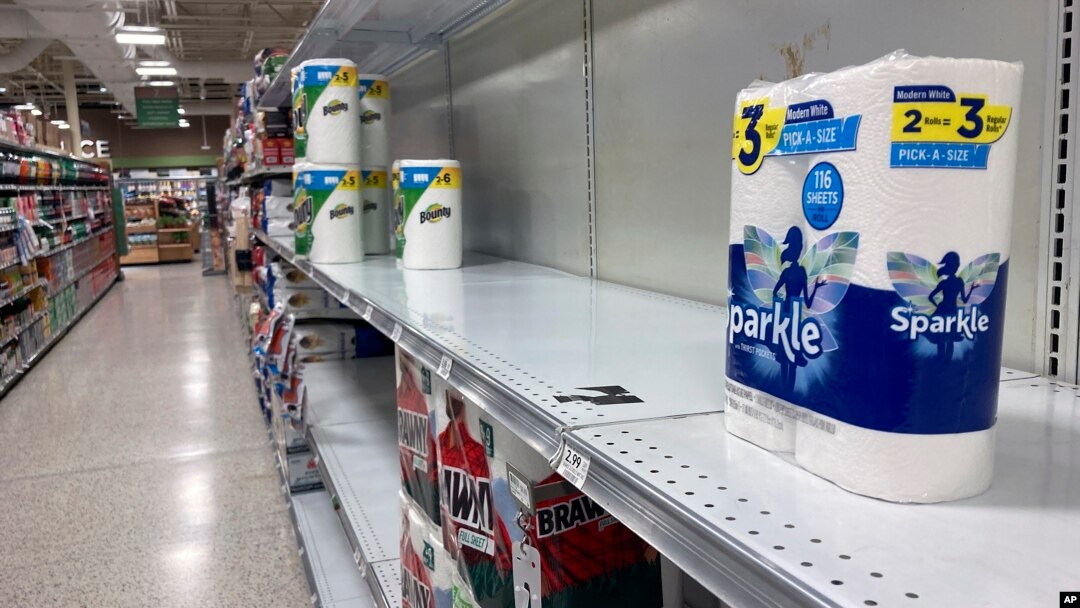 Near empty shelves are seen in the paper goods section of a supermarket, Jan. 13, 2022, in Orlando, Florida.