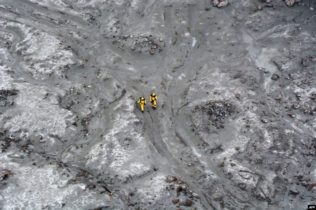 Elite soldiers take part in a mission to find bodies from White Island after this week's volcanic eruption, off the coast from Whakatane on the North Island, in this handout image taken by the New Zealand Defence Force.