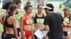 Tracktown star Alexi Pappas (center) speaks with director Jeremy Teicher during filming on location at historic Hayward Field in Eugene
