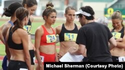 Tracktown star Alexi Pappas (center) speaks with director Jeremy Teicher during filming on location at historic Hayward Field in Eugene