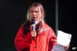 FILE - Climate activist Greta Thunberg speaks on the stage after a protest during the Cop26 summit in Glasgow, Scotland, Nov. 5, 2021. (Jane Barlow/PA via AP)