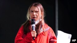 FILE - Climate activist Greta Thunberg speaks on the stage after a protest during the Cop26 summit in Glasgow, Scotland, Nov. 5, 2021.