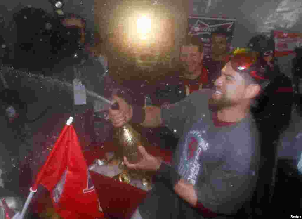 Oct 30, 2013; Boston, MA, USA; Boston Red Sox center fielder Jacoby Ellsbury (right) celebrates with teammates after winning game six of the MLB baseball World Series at Fenway Park. Red Sox won 6-1. Mandatory Credit: Greg M. Cooper-USA TODAY Sports - RTX