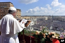 Pope Francis delivers his Urbi et Orbi (to the city and to the world) message from the main balcony of St. Peter's Basilica, at the Vatican, April 16, 2017.