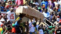 FILE: Zanu PF supporters carrying 'coffin' of MDC leader Nelson Chamisa ahead of the 2018 general elections.