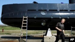 FILE - Submarine owner-builder Peter Madsen is seen with his UC3 Nautilus in a April 30, 2008, photo.