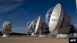 FILE - Radio telescope antennas of the ALMA (Atacama Large Millimeter/submillimeter Array) project, in the Atacama desert, some 1500 km north of Santiago, Chile, March 12, 2013. Scientists using the ALMA have detected, for the first time, methanol in the planet-forming disk around a very young star.