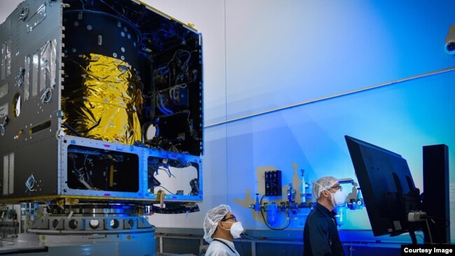 In this photo, taken in November 2020, technicians power on the main body of NASA's Psyche spacecraft — called the Solar Electric Propulsion (SEP) Chassis — for the first time, in a clean room at Maxar Technologies in Palo Alto, California. (Image Credit: