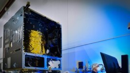 In this photo, taken in November 2020, technicians power on the main body of NASA's Psyche spacecraft — called the Solar Electric Propulsion (SEP) Chassis — for the first time, in a clean room at Maxar Technologies in Palo Alto, California. (Image Credit: