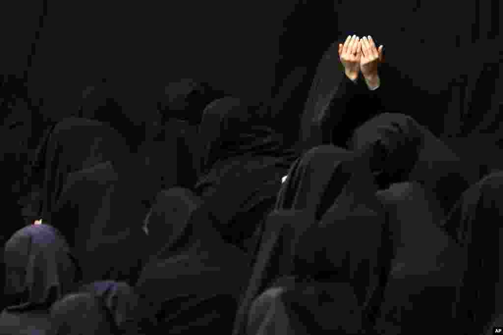 Iranian Shiite Muslim women mourn during a ceremony at Sadat Akhavi Mosque in Tehran, three days prior to the anniversary of 7th century Shi&#39;ite Imam Hussein, the grandson of Prophet Muhammad, who was killed in a battle in Karbala in present-day Iraq.