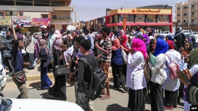 Protesters shout "freedom, peace, justice" during an anti-government demonstration in Khartoum, Sudan, March 18, 2019. 