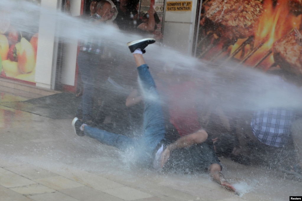 Turkish police use a water cannon to disperse demonstrators during a protest against the replacement of Kurdish mayors with state officials in three cities, in Diyarbakir, August 19, 2019.
