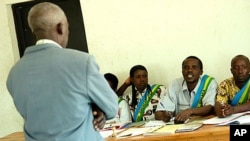 Boniface Kajyarugamba stands in front of a Gacaca court in Mayange, Rwanda, Thursday, Aug. 9, 2007 (file photo).