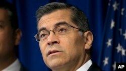 FILE - California Attorney General Xavier Becerra speaks to reporters at the Capitol in Sacramento, Sept. 5, 2017. Becerra says a meeting about social media in Washington on Sept. 25, 2018, that included the U.S. attorney general and a number of his fellow state attorneys general focused on consumer protection and data privacy issues.