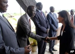 U.S. Ambassador to the United Nations Nikki Haley, right, meets South Sudanese officials on her arrival in Juba, South Sudan, Oct. 25, 2017.