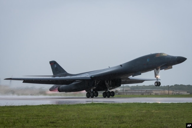 FILE - US Air Force B1-B Bomber takes off from Andersen Air Force Base, Guam, to fly a mission with Japan Air Self-Defense Force F-15s, Sept. 9, 2017. (Senior Airman Jacob Skovo/U.S. Air Force via AP)