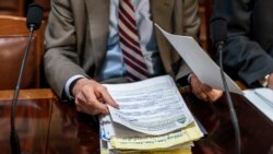 House Energy and Commerce Chairman Frank Pallone, D-N.J., goes over his notes as the House Rules Committee begins work on President Joe Biden's sweeping domestic agenda, the Build Back Better Act, at the Capitol in Washington, Nov. 3, 2021.