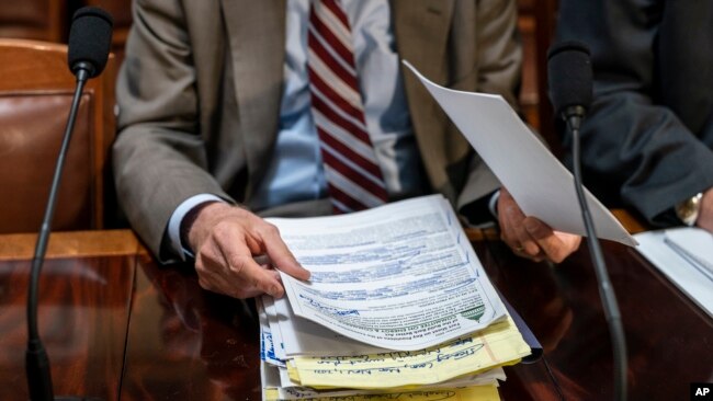 House Energy and Commerce Chairman Frank Pallone, D-N.J., goes over his notes as the House Rules Committee begins work on President Joe Biden's sweeping domestic agenda, the Build Back Better Act, at the Capitol in Washington, Nov. 3, 2021.