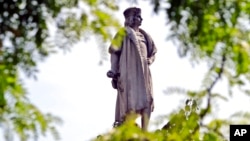 FILE - This Aug. 27, 2017, photo shows the Christopher Columbus statue at Manhattan's Columbus Circle in New York. 