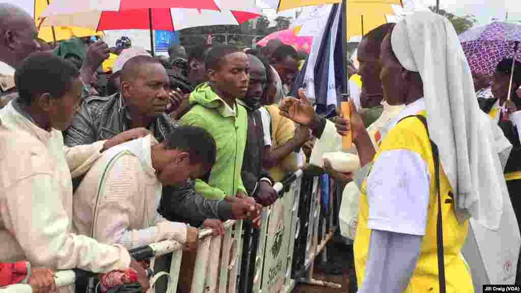 Kenyan Catholics take Holy Communion during a Mass celebrated by Pope Francis at the University of Nairobi, in Kenya, Nov. 26, 2015.