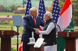 U.S. President Donald Trump and Indian Prime Minister Narendra Modi shake hands after giving a joint statement in New Delhi, India, Tuesday, Feb. 25, 2020.