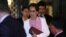 FILE - Myanmar's leader Aung San Suu Kyi leaves the International Court of Justice (ICJ), the top United Nations court, after court hearings in a case filed by Gambia against Myanmar alleging genocide against the minority Muslim Rohingya population.