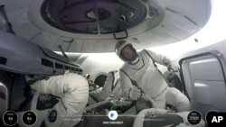 This image made from a SpaceX video shows the crew of the first private spacewalk led by tech billionaire Jared Isaacman inside the capsule, Thursday Sept. 12, 2024. (SpaceX via AP)