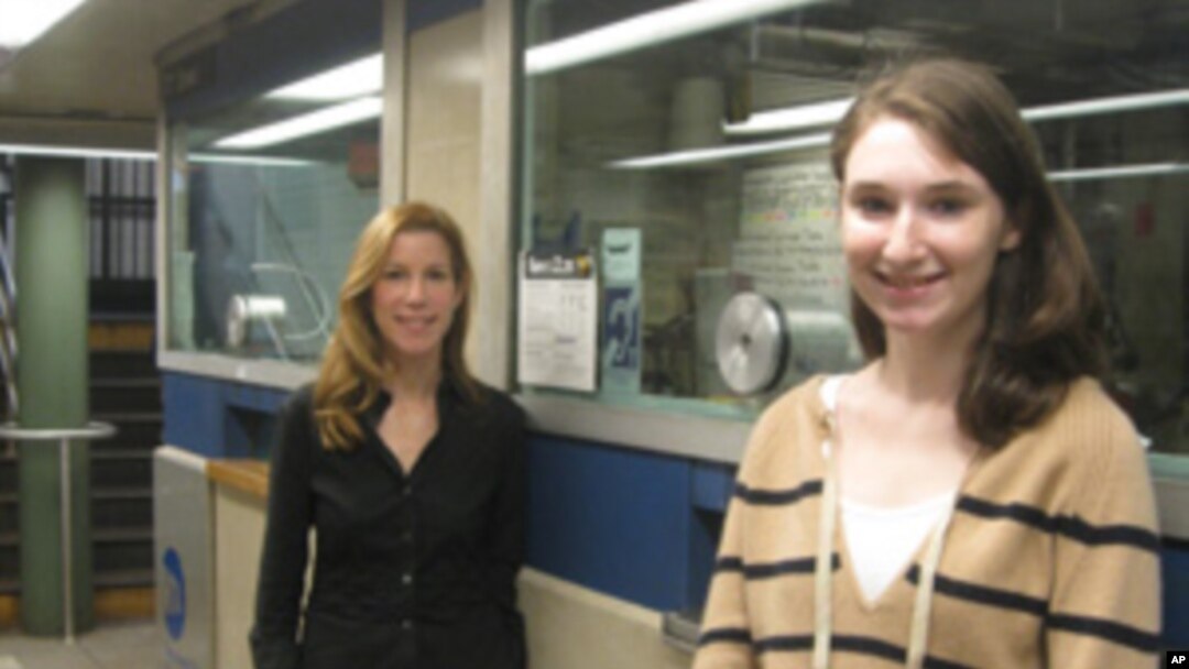 Janice and Arielle Schacter at one of the New York subway information booths which is equipped with a hearing loop.