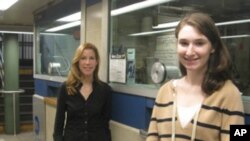 Janice and Arielle Schacter at one of the New York subway information booths which is equipped with a hearing loop.