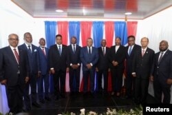 FILE —Haiti's Transitional Council at ceremony on the outskirts of Port-au-Prince, Haiti April 25, 2024.